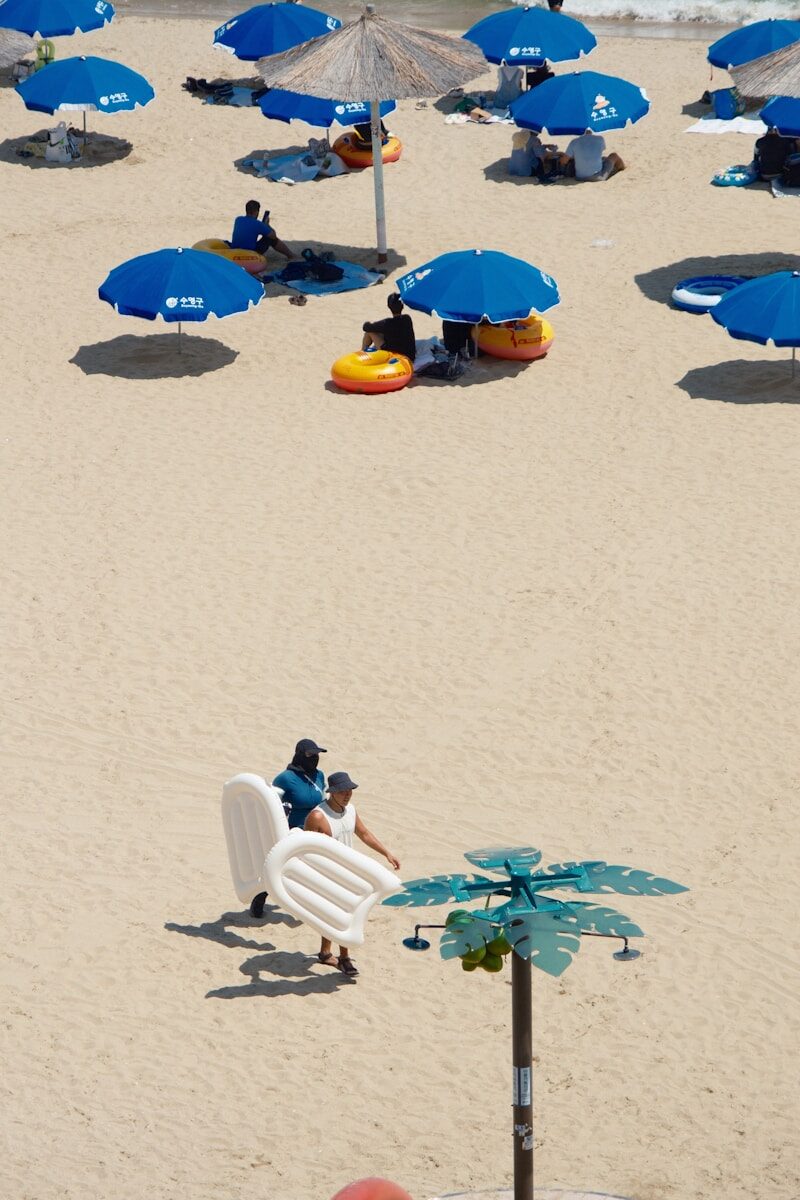 A bunch of umbrellas that are on a beach