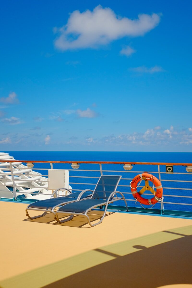 a deck with chairs and umbrellas